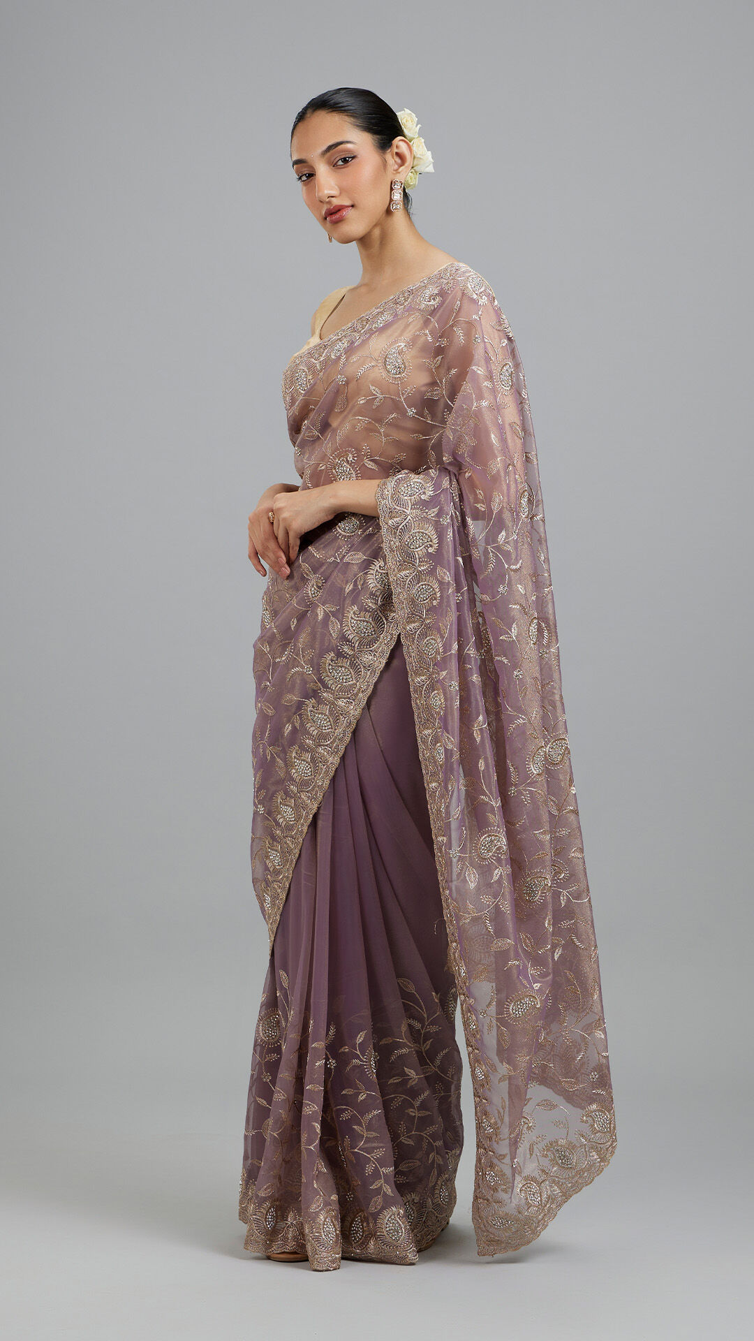 Women flaunting her beautifull purple net saree